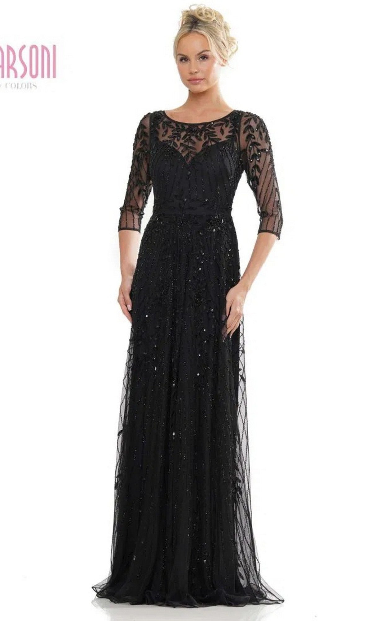 A woman models the Marsoni MV1283 long formal dress in black, featuring sheer three-quarter sleeves and decorative beading—ideal for a mother of the bride—against a white background.